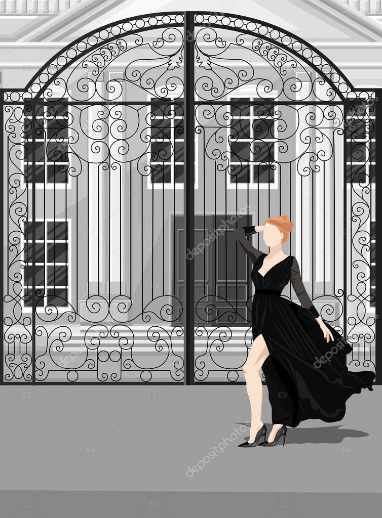 Woman in black dress posing in front of castle gates