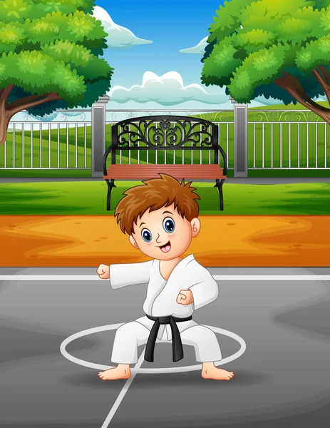 Cute Little Boy Practicing Karate Outdoors — Stock Vector