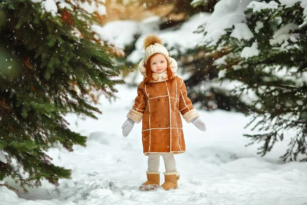 Little Red Haired Girl Kid Catches Snowflakes Park Winter Trees — Stock Photo, Image