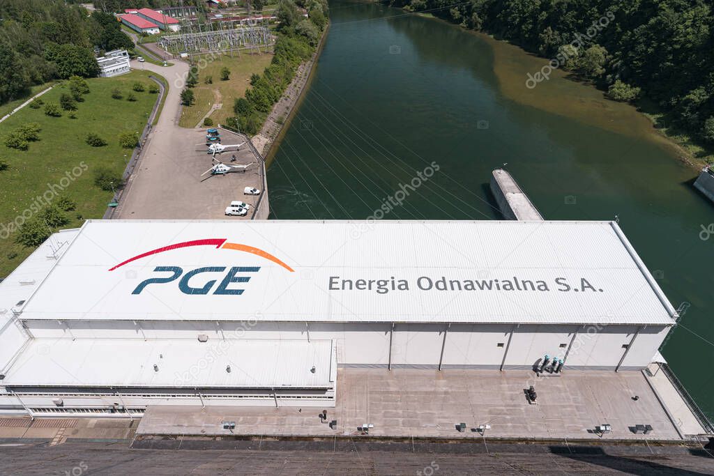 Solina, Poland - June 24, 2019: Polska Grupa Energetyczna Energia Odnawialna (PGE-EO) logo near Solina Dam in Poland. Subsidiary of PGE Polands largest power conglomerate and one of the largest power sector players in Central and Eastern Europe.