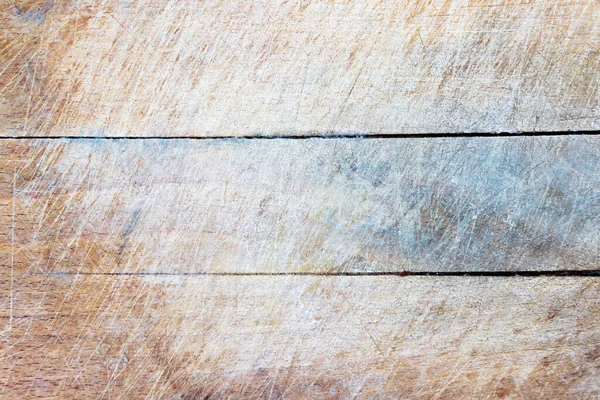 Old rugged wooden kitchen cutting board background.
