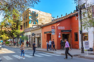 Santiago, Chile - Oct 1st 2017 - Group of people walking in the streets of Bela vista neighbourhood in Santiago del Chile clipart