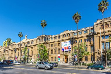 Santiago, Chile - Oct 1st 2017 - A big university building with cars in a wide avenue in a blue sky day in Santiago clipart