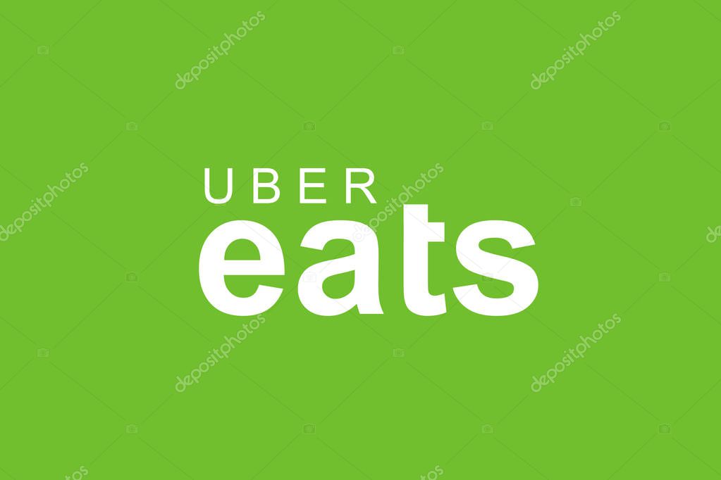 Portugal, Lisbon June 13, 2018: illustration of the UBER eats logo on a green background. A popular firm for the delivery of food at home and in offices.