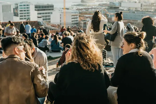 stock image Lisbon, 01 May 2018: Many young people of local people, tourists and migrants on the city lookout platform which is a meeting place for young people and communication between them