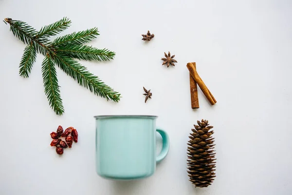 Stock image A cup of fragrant and delicious tea or coffee on a white surface decorated in a Christmas style. Creative idea