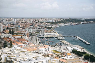 Beautiful panoramic view from above to the port city of Setubal in Portugal located on the Atlantic coast clipart