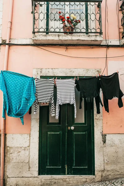 Clothes dry on the street in Lisbon in Portugal.