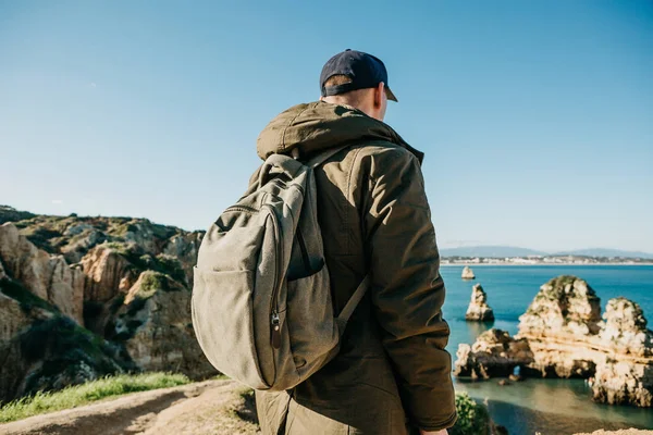 stock image Tourist or traveler with a backpack on the Atlantic coast.