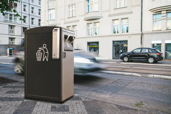 A modern smart trash can on the street in Prague. Waste collection for further disposal. New technologies for garbage collection.