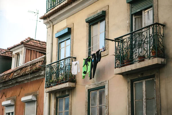 Authentic photography. Clothes dry on the facade of an apartment building in Lisbon