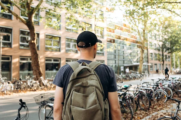 A student with a backpack or a tourist on Leipzig Street in Germany — Stock Photo, Image