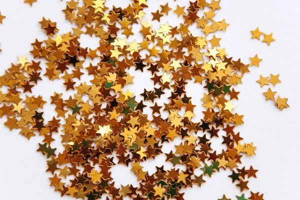 Festive background of golden confetti stars — Stock Photo, Image