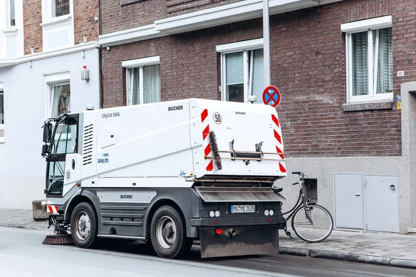 A special truck or street cleaning vehicle rides along the road and cleans the street from dirt and dust. — Stock Photo, Image