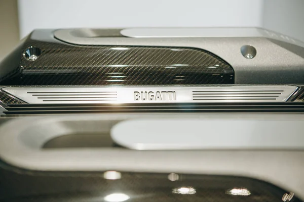 Closeup sign of Bugatti on the engine of a new sports car. Royalty Free Stock Photos