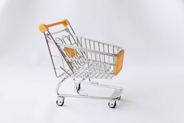 Empty cart for products and goods on a white background