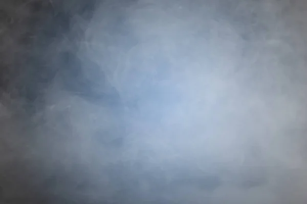 Fumaça ou nevoeiro sobre fundo preto azul — Fotografia de Stock