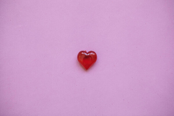 Red heart on a pink background.