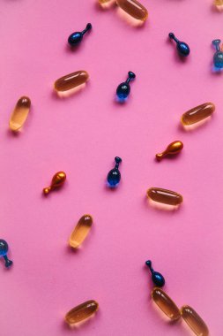 Omega 3, hyaluronik asit ve koenzim kapsül arka plan. Cilt ve vücut sağlığı için bakım