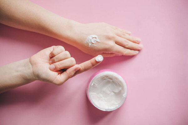 Female hands with cream