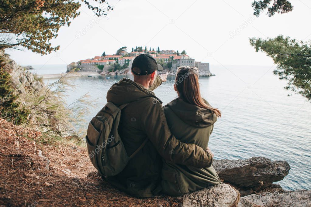 Couple looking at Sveti Stefan