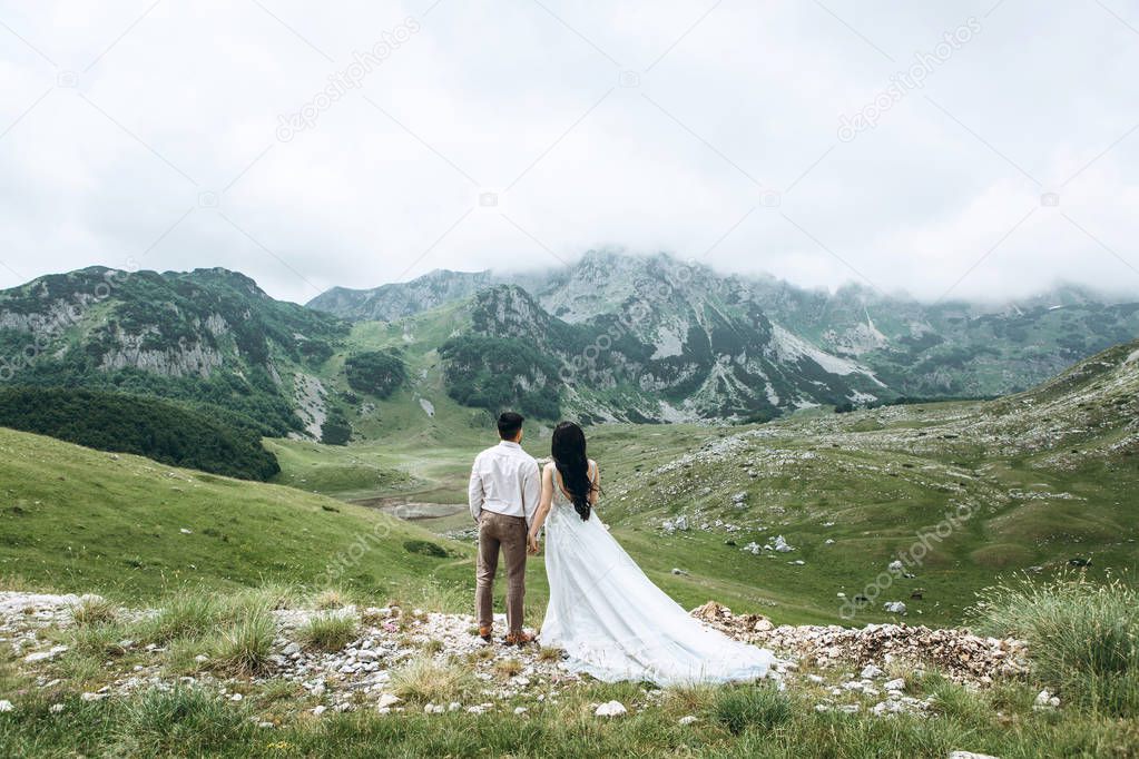Couple on a background of mountains