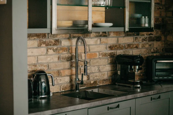 Kitchen with a brick wall — Stock Photo, Image