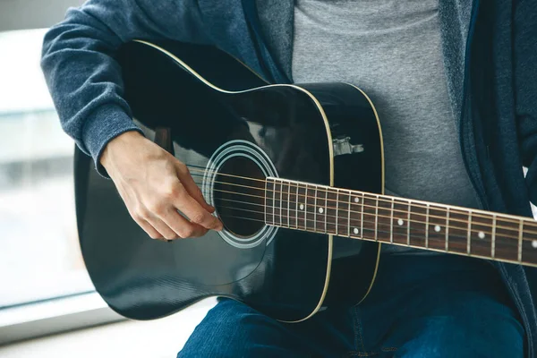 The guitarist plays the guitar. Or a person learns to play the guitar.