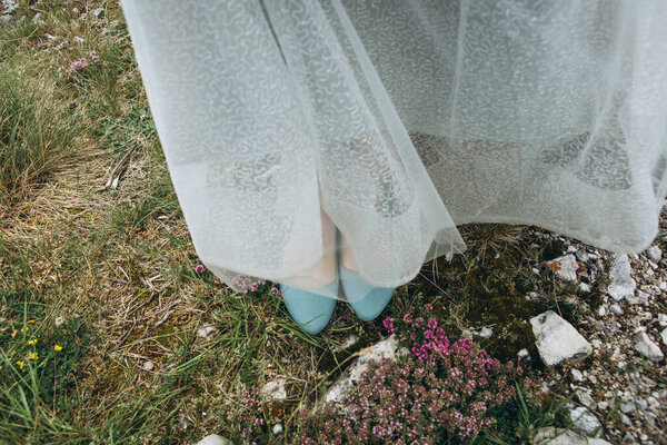 Close up of bride's shoes on the wedding day.