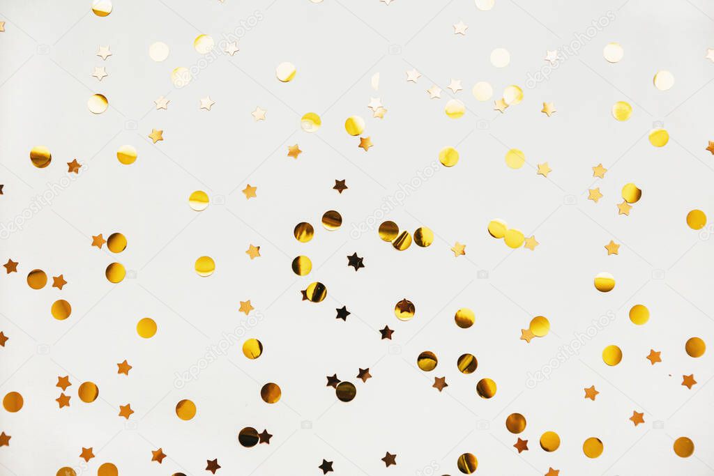 Scattered golden confetti background
