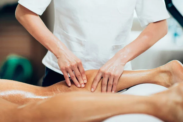 Sports Massage Physical Therapist Massaging Leg Young Male Athlete — Stock Photo, Image