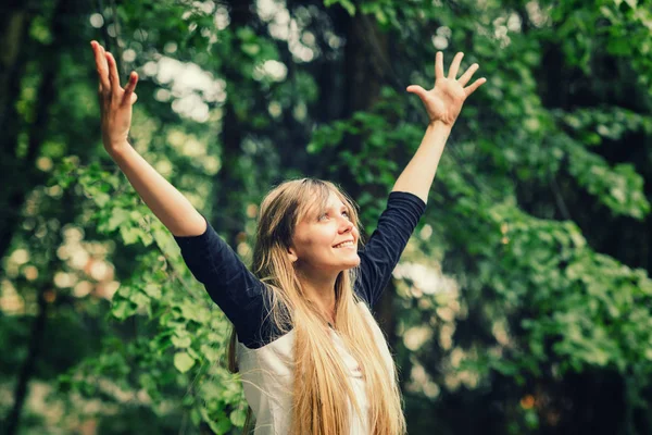 Smiling Young Woman Doing Yoga Hands Stock Photo