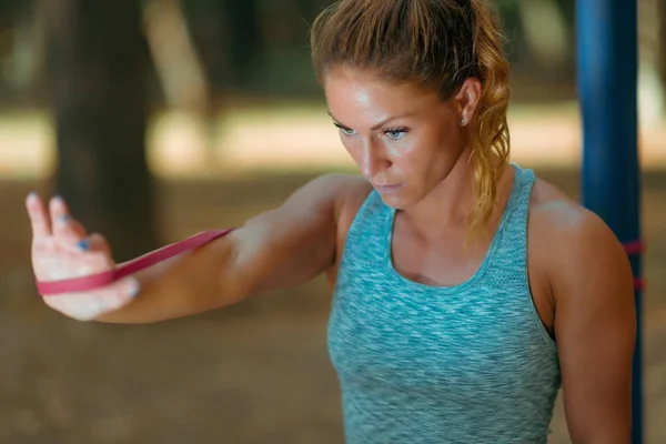 Woman Exercising Elastic Band Outdoors Fall Public Park — Stock Photo, Image