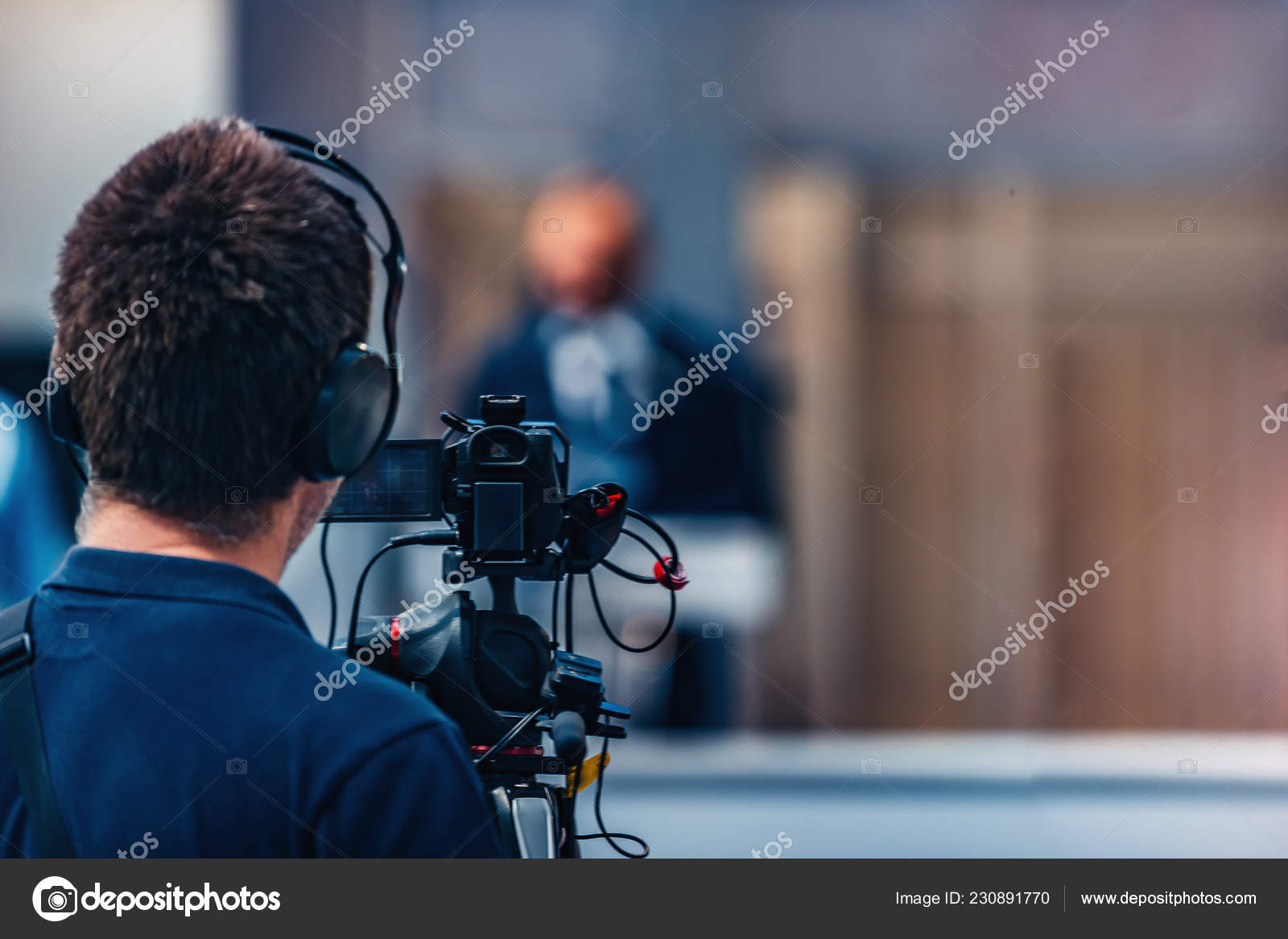 Cameraman Recording Male Speaker Wearing Suit Media Press Conference