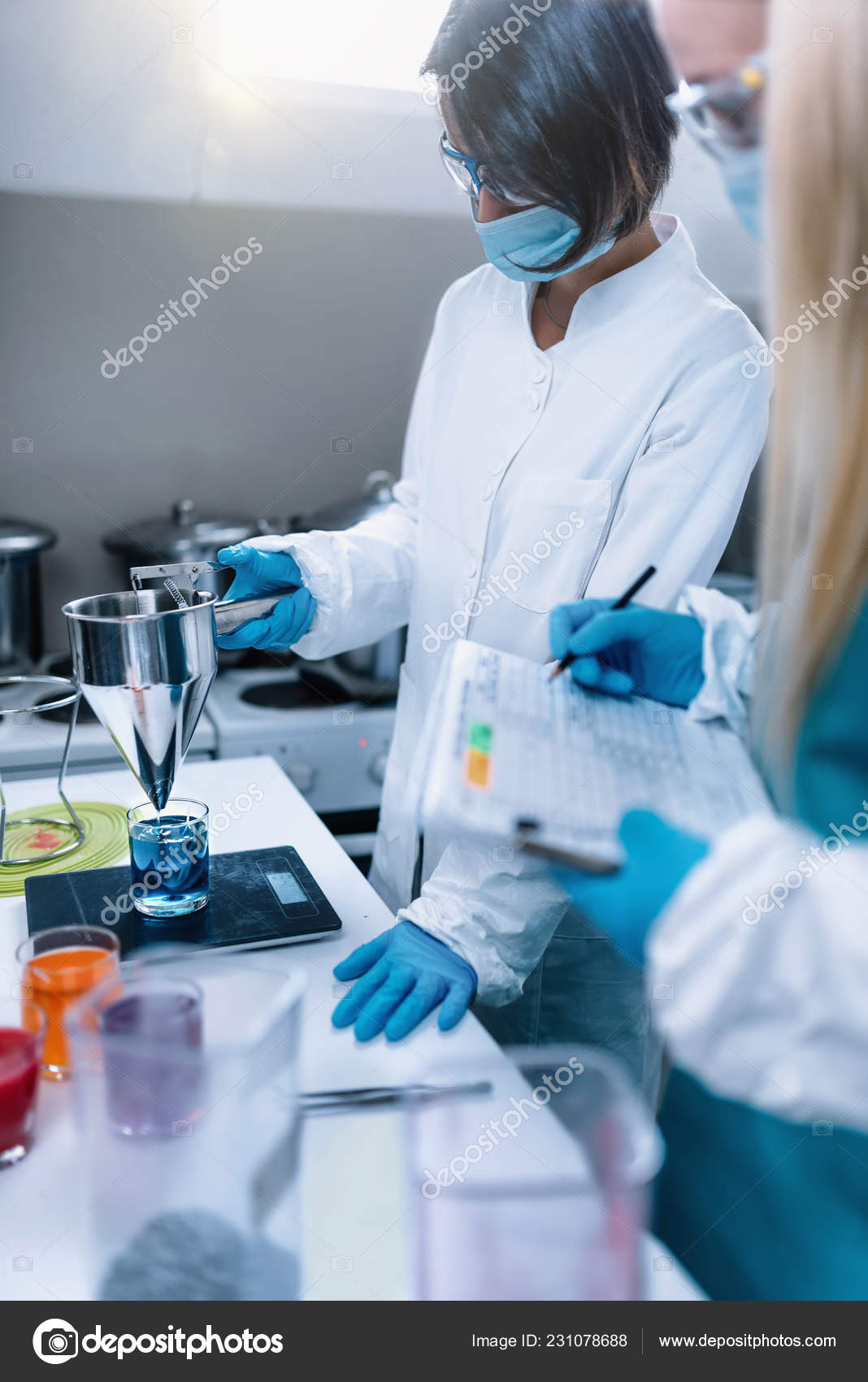 Female Candle Maker Pouring Melted Orange Wax Into The Glass With Glued  Wooden Wick And Measure It On Digital Scale. Wearing Protective Work Wear. Candle  Making Process Stock Photo, Picture and Royalty