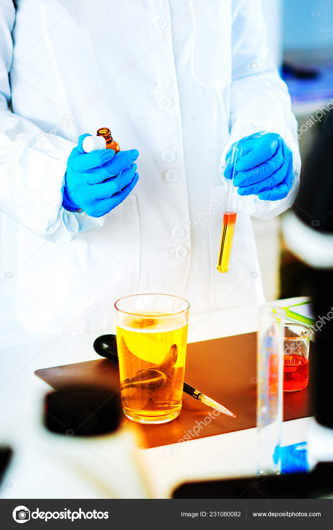 Quality Control Expert Inspecting Beer Laboratory Stock Photo by