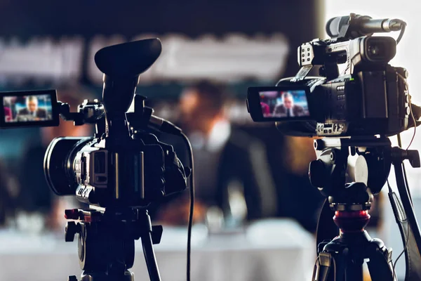 Two Camera Recording Presentation Press Conference Blurred Speakers Wearing Suit — Stock Photo, Image