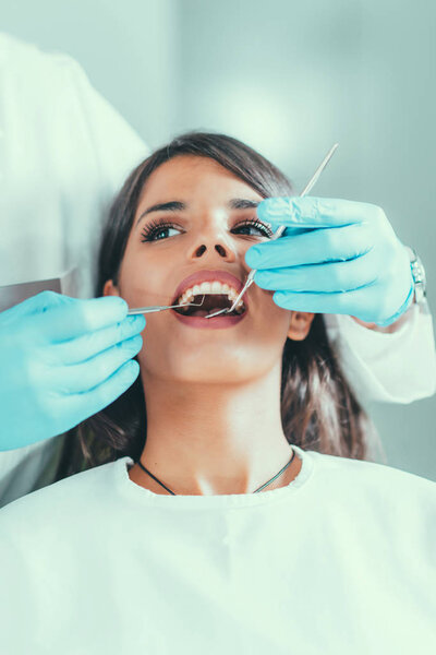 Pretty young woman at dentist procedure
