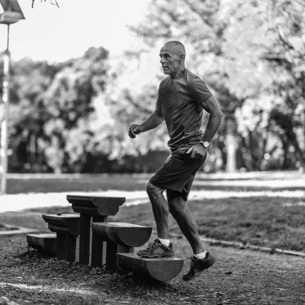 Senior Male Exercising Outdoors Public Park — Stock Photo, Image