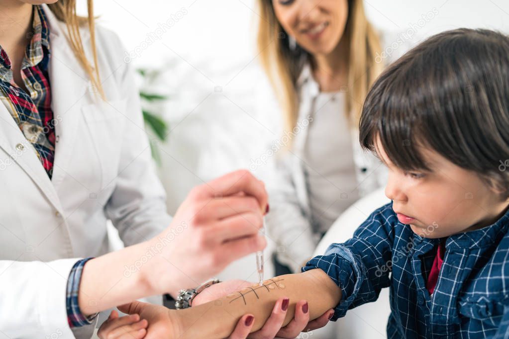 Immunologist Testing Allergy Reaction on a Boys Arm 