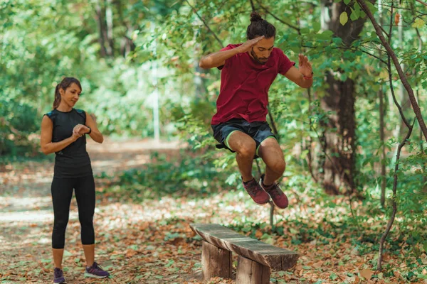 Friends Exercising Outdoors Park Jumping Bench — Stock Photo, Image