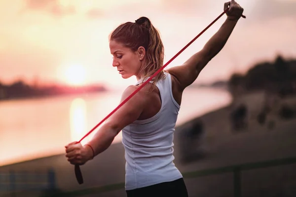 Woman Exercising Resistance Band Outdoors Lake — Stock Photo, Image