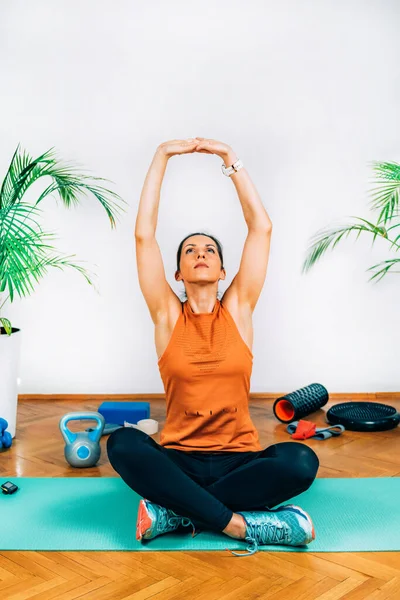 Home Exercising. Woman Stretching at Home