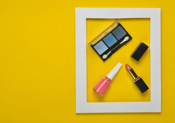 Female Cosmetics White Frame Yellow Background Shadows Make Lipstick Nail — Stock Photo, Image