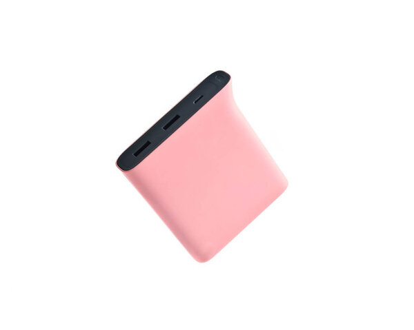 Pastel pink power bank isolated on white background. External battery for smartphones and other gadgets.