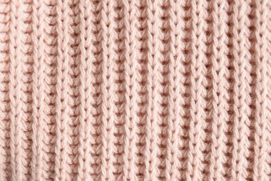 Pembe örgü kazak yakın çekim doku. Üstten görünüm. Tekstil Giyim.