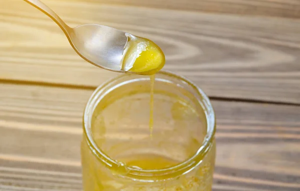 Metal Spoon Bee Honey Close Wooden Table — Stock Photo, Image