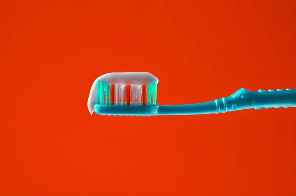 Toothpaste Blue Toothbrush Close Yellow Light Background — Stock Photo, Image
