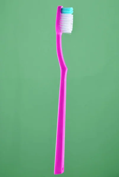 Rosa Zahnbürste Auf Mintfarbenem Pastell Hintergrund — Stockfoto