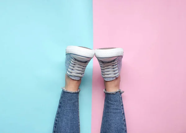 Women Legs Tight Torn Jeans Sneakers Pink Blue Pastel Background — Stock Photo, Image